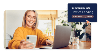 Woman looking at her phone and smiling with a community info pop-up bubble