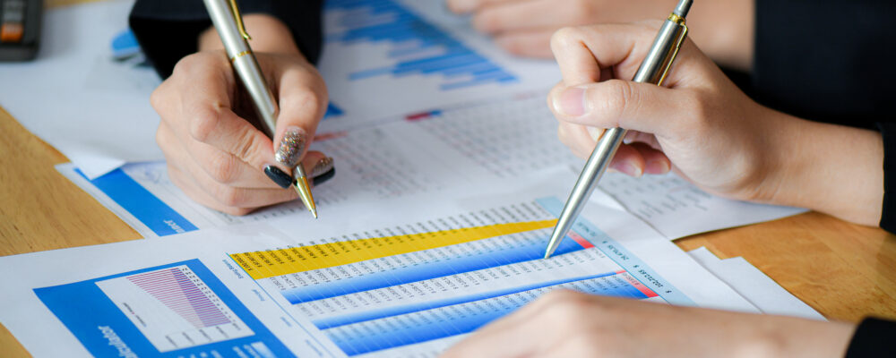 Datasheets, two hands with pencils