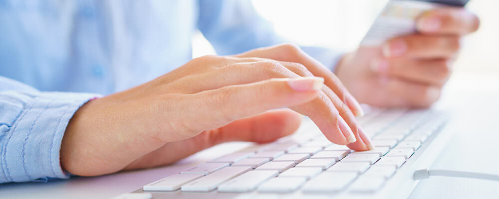 Woman typing on a keyboard