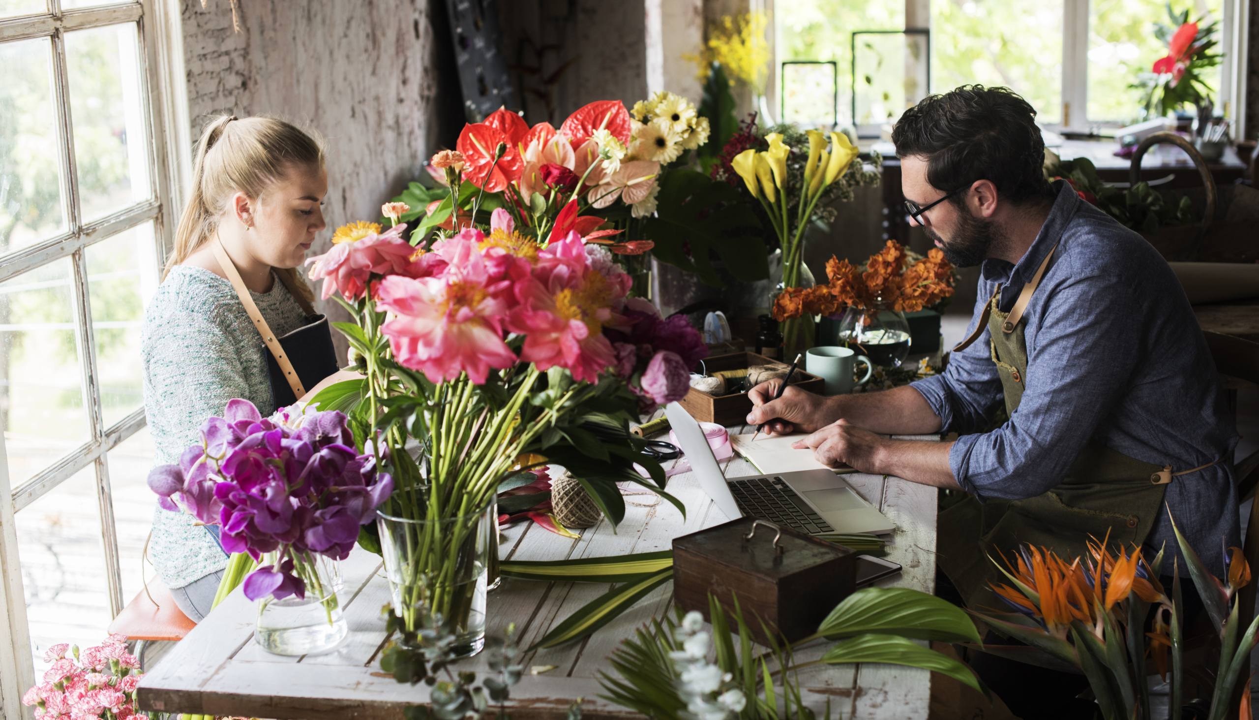 Flower shop business owner working service